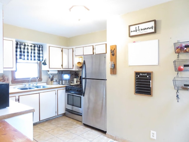 2020 Greengold St, Crest Hill, IL 60403 - kitchen featuring stainless steel appliances, a sink, white cabinetry, and light countertops