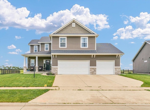 1908 Littlefield Ln, Mahomet, IL 61853 - craftsman inspired home with stone siding, concrete driveway, covered porch, and a garage
