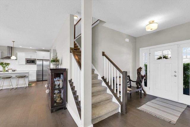 1908 Littlefield Ln, Mahomet, IL 61853 - entrance foyer with dark wood-style flooring, stairs, recessed lighting, and a textured ceiling