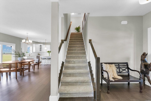 1908 Littlefield Ln, Mahomet, IL 61853 - staircase featuring wood finished floors and a chandelier