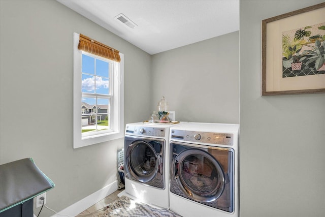 1908 Littlefield Ln, Mahomet, IL 61853 - washroom with washing machine and dryer, baseboards, and tile patterned floors
