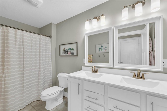 1908 Littlefield Ln, Mahomet, IL 61853 - bathroom featuring toilet, double vanity, tile patterned floors, a textured ceiling, and a shower with shower curtain