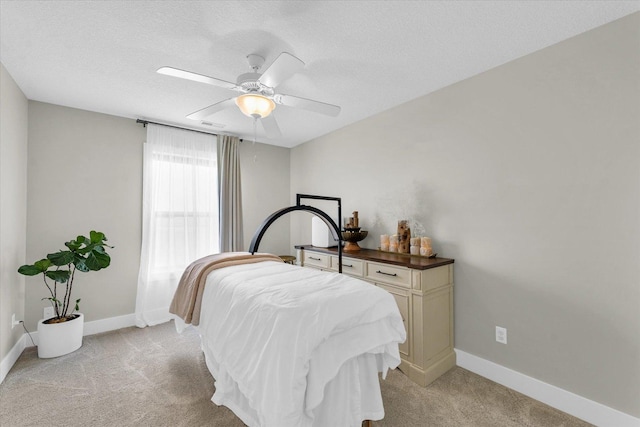 1908 Littlefield Ln, Mahomet, IL 61853 - bedroom with light carpet, baseboards, a ceiling fan, and a textured ceiling