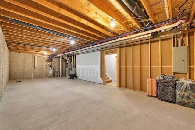 1908 Littlefield Ln, Mahomet, IL 61853 - unfinished below grade area featuring electric panel, stairs, and gas water heater