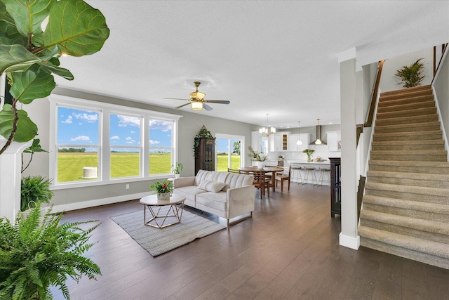 1908 Littlefield Ln, Mahomet, IL 61853 - living area with a ceiling fan, stairway, baseboards, and dark wood-style flooring
