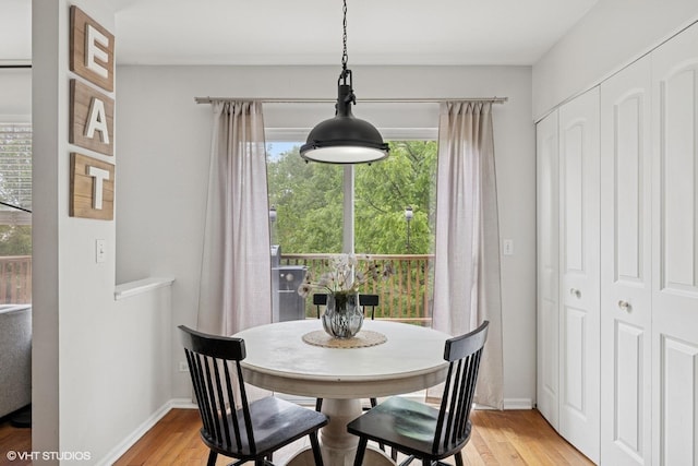 2834 Forestview Dr, Carpentersville, IL 60110 - dining area featuring light wood-style flooring and baseboards