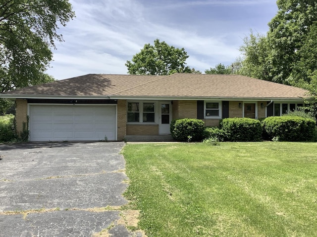 404 W Francis Rd, New Lenox, IL 60451 - ranch-style home with asphalt driveway, brick siding, an attached garage, and a front yard