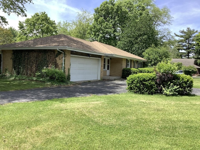 404 W Francis Rd, New Lenox, IL 60451 - ranch-style home with brick siding, asphalt driveway, a garage, and a front yard