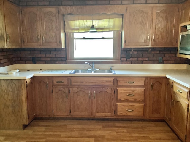 404 W Francis Rd, New Lenox, IL 60451 - kitchen with a sink, light countertops, and light wood-style floors