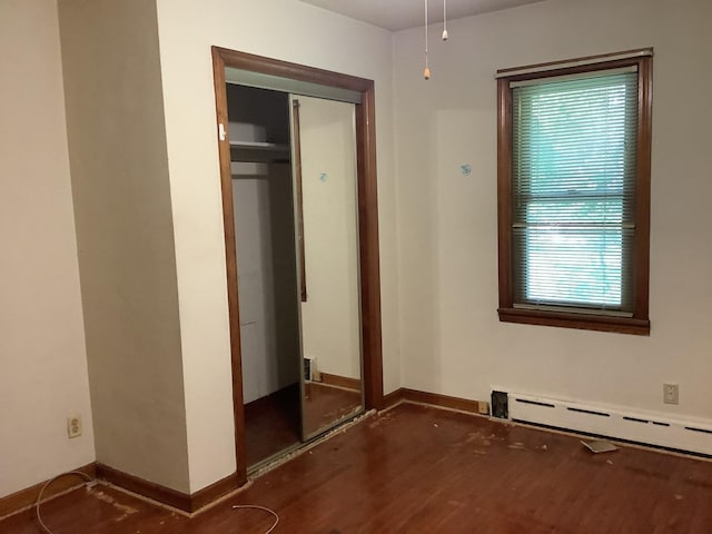 404 W Francis Rd, New Lenox, IL 60451 - unfurnished bedroom featuring a baseboard heating unit, wood finished floors, and baseboards