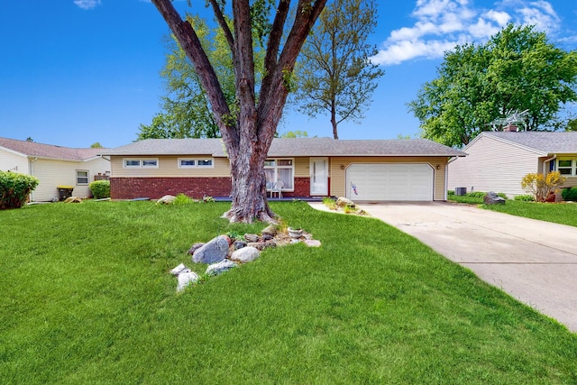 143 Scott Dr, East Dundee, IL 60118 - ranch-style house with a garage, driveway, and a front lawn
