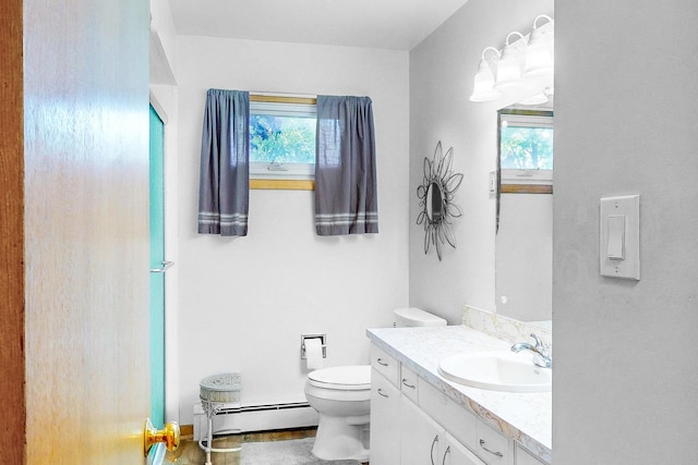 143 Scott Dr, East Dundee, IL 60118 - bathroom featuring a baseboard heating unit, vanity, toilet, and healthy amount of natural light