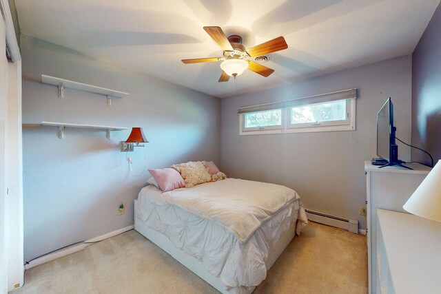 143 Scott Dr, East Dundee, IL 60118 - bedroom featuring a baseboard radiator, light carpet, and a ceiling fan
