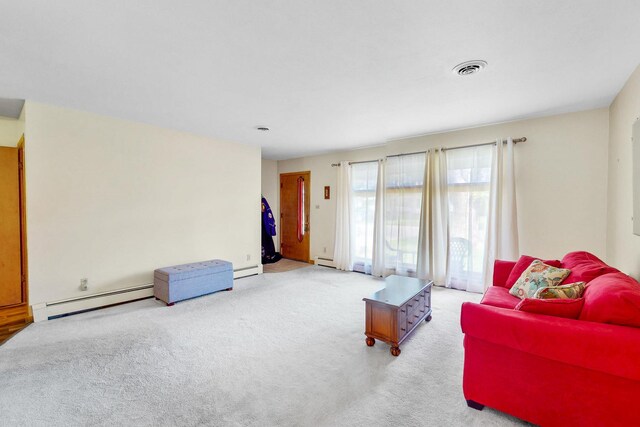 143 Scott Dr, East Dundee, IL 60118 - carpeted living room with a baseboard heating unit