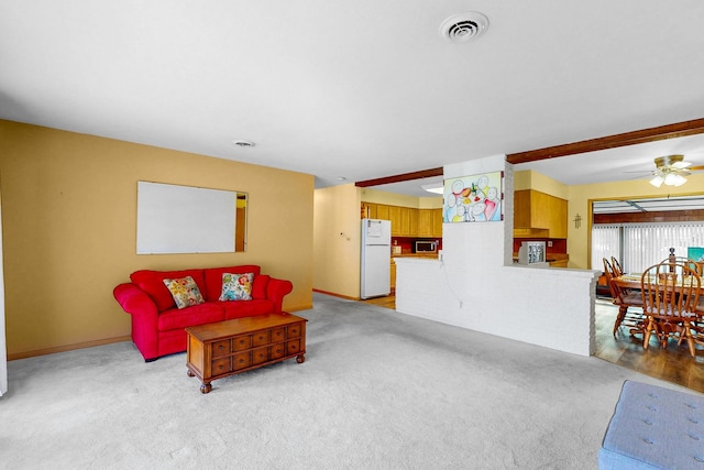 143 Scott Dr, East Dundee, IL 60118 - living room with a ceiling fan, light colored carpet, and baseboards