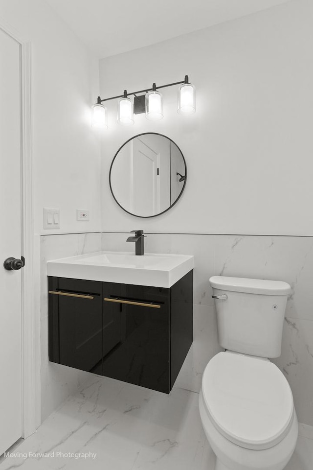 7953 S Stewart Ave, Chicago, IL 60620 - half bathroom featuring vanity, marble finish floors, and toilet