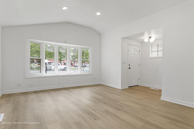 7953 S Stewart Ave, Chicago, IL 60620 - unfurnished living room with plenty of natural light, light wood finished floors, lofted ceiling, baseboards, and recessed lighting