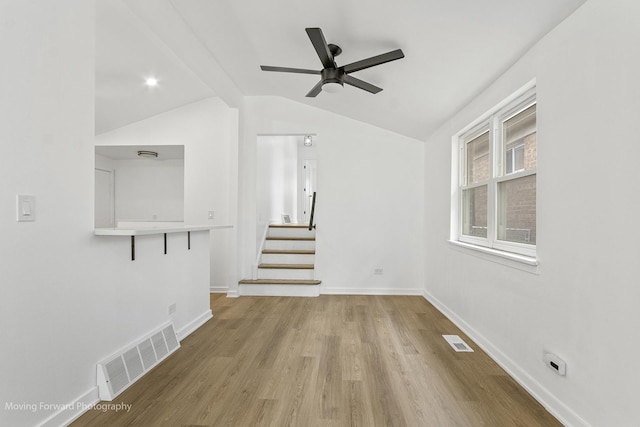 7953 S Stewart Ave, Chicago, IL 60620 - unfurnished living room with a ceiling fan, lofted ceiling, wood finished floors, baseboards, and stairs