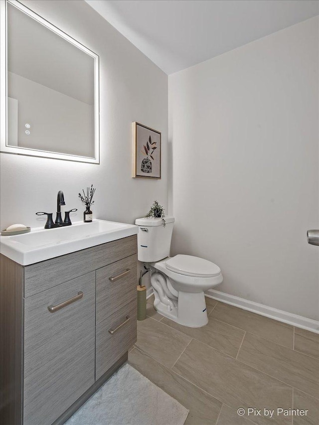 1520 Silver Maple Ct, Naperville, IL 60563 - bathroom with vanity, toilet, baseboards, and tile patterned floors
