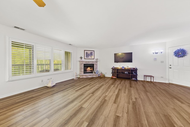 2625 Essington Rd Unit 2625, Joliet, IL 60435 - unfurnished living room with wood finished floors, a fireplace, and baseboards
