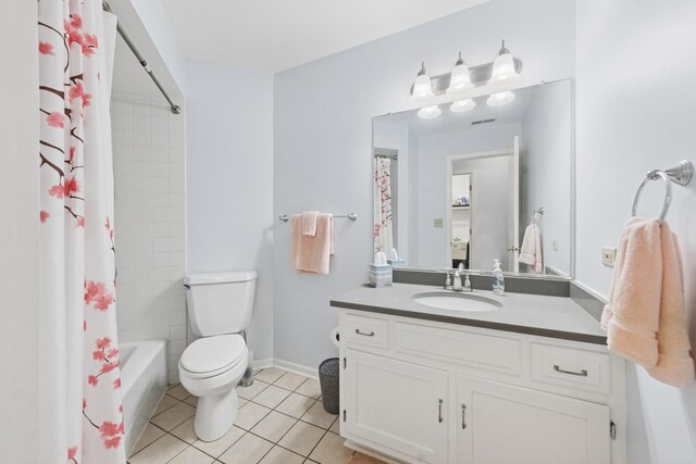 2625 Essington Rd Unit 2625, Joliet, IL 60435 - full bath with vanity, tile patterned flooring, toilet, shower / bath combination with curtain, and baseboards
