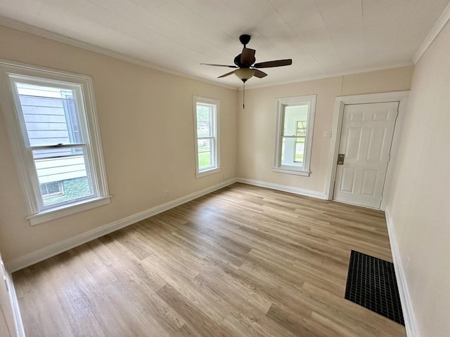964 S Washington Ave, Kankakee, IL 60901 - spare room featuring ornamental molding, light wood-style flooring, a ceiling fan, and baseboards