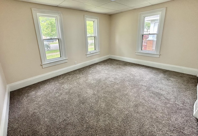 964 S Washington Ave, Kankakee, IL 60901 - empty room featuring a drop ceiling, baseboards, and carpet flooring