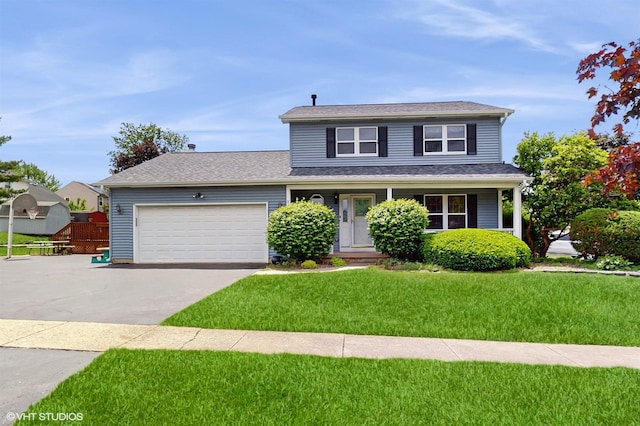 8401 Adbeth Ave, Woodridge, IL 60517 - traditional home featuring concrete driveway, a front yard, a garage, and covered porch