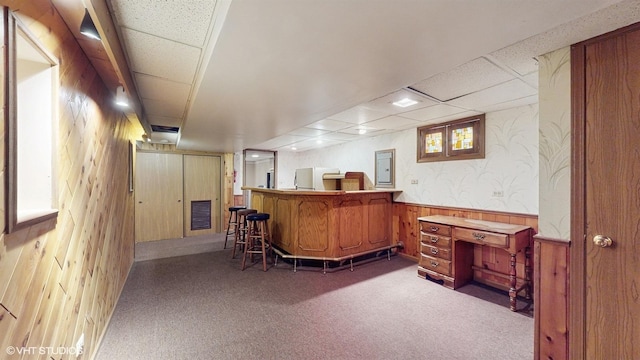 8401 Adbeth Ave, Woodridge, IL 60517 - bar featuring a drop ceiling, carpet flooring, wooden walls, refrigerator, and electric panel