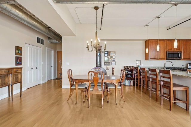 170 N NW Hwy Unit 401, Park Ridge, IL 60068 - dining space with a chandelier and light wood finished floors