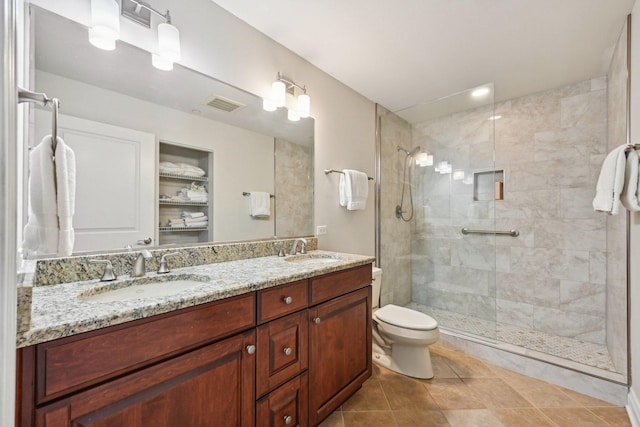 170 N NW Hwy Unit 401, Park Ridge, IL 60068 - bathroom featuring double vanity, a stall shower, toilet, and tile patterned flooring