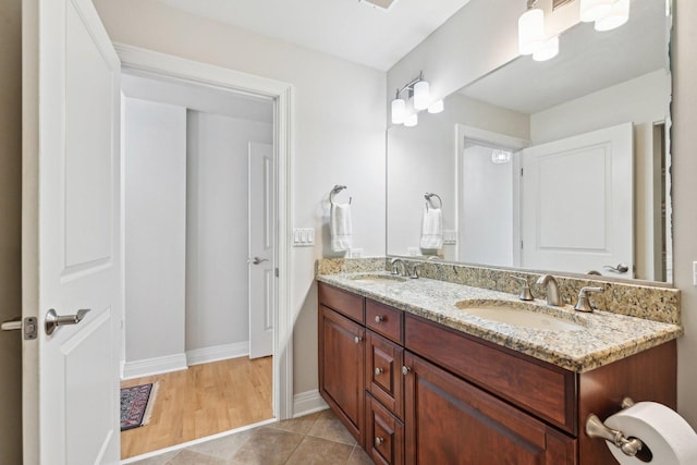 170 N NW Hwy Unit 401, Park Ridge, IL 60068 - bathroom featuring double vanity, baseboards, and tile patterned floors