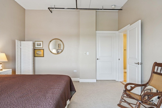 170 N NW Hwy Unit 401, Park Ridge, IL 60068 - bedroom with light colored carpet, baseboards, and a towering ceiling
