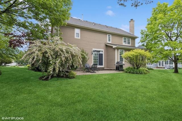 5 N Chestnut Ct, Hawthorn Woods, IL 60047 - back of property with a chimney, a yard, and a patio
