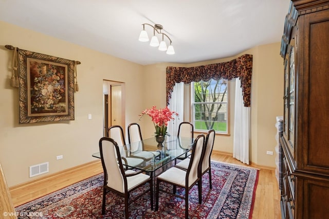 5 N Chestnut Ct, Hawthorn Woods, IL 60047 - dining room with light wood-style floors and baseboards