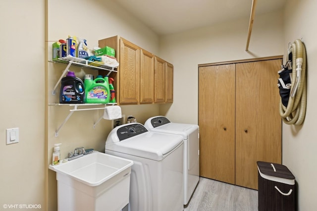 5 N Chestnut Ct, Hawthorn Woods, IL 60047 - washroom with washer and dryer, light wood finished floors, and cabinet space