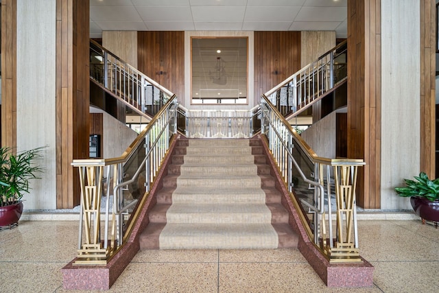 3200 N Lake Shore Dr Unit 911, Chicago, IL 60657 - stairway featuring wooden walls and a drop ceiling