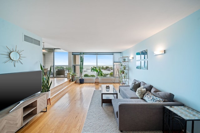 3200 N Lake Shore Dr Unit 911, Chicago, IL 60657 - living area with wood finished floors and a wall of windows