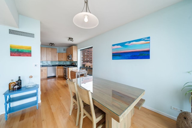 3200 N Lake Shore Dr Unit 911, Chicago, IL 60657 - dining room with light wood-style floors and baseboards