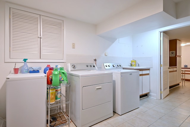 8 S Merrill, Park Ridge, IL 60068 - washroom with separate washer and dryer, cabinet space, and light tile patterned floors