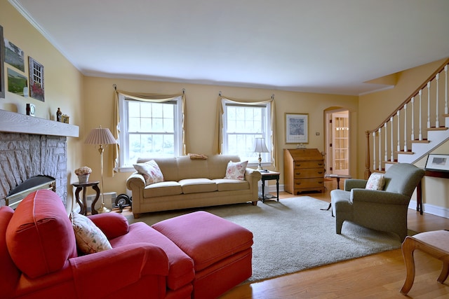 8 S Merrill, Park Ridge, IL 60068 - living area featuring arched walkways, wood finished floors, stairway, ornamental molding, and a fireplace