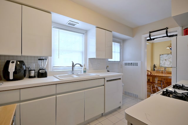 8 S Merrill, Park Ridge, IL 60068 - kitchen with a sink, tasteful backsplash, white cabinets, and light tile patterned flooring