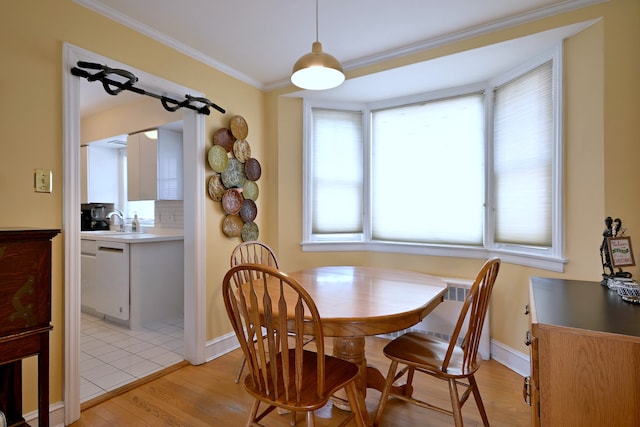 8 S Merrill, Park Ridge, IL 60068 - dining area with light wood-style flooring, crown molding, radiator heating unit, and baseboards