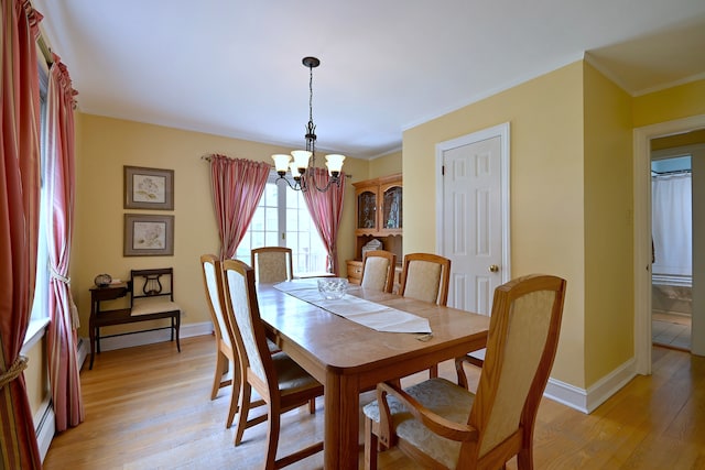 8 S Merrill, Park Ridge, IL 60068 - dining space with a baseboard radiator, a chandelier, light wood-style floors, ornamental molding, and baseboards