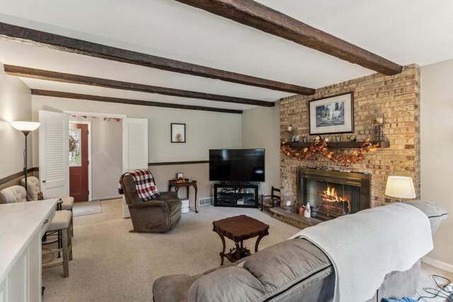 961 N Arrowhead Dr, Palatine, IL 60074 - living room with a fireplace, light carpet, beamed ceiling, and baseboards