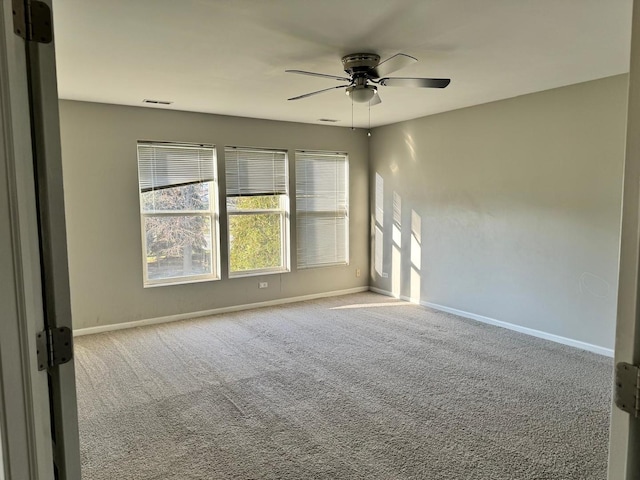 3292 Bromley Ln, Aurora, IL 60502 - unfurnished room with ceiling fan, baseboards, and carpet flooring