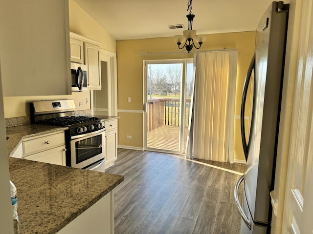 3292 Bromley Ln, Aurora, IL 60502 - kitchen with appliances with stainless steel finishes, dark wood-type flooring, white cabinetry, a chandelier, and stone countertops