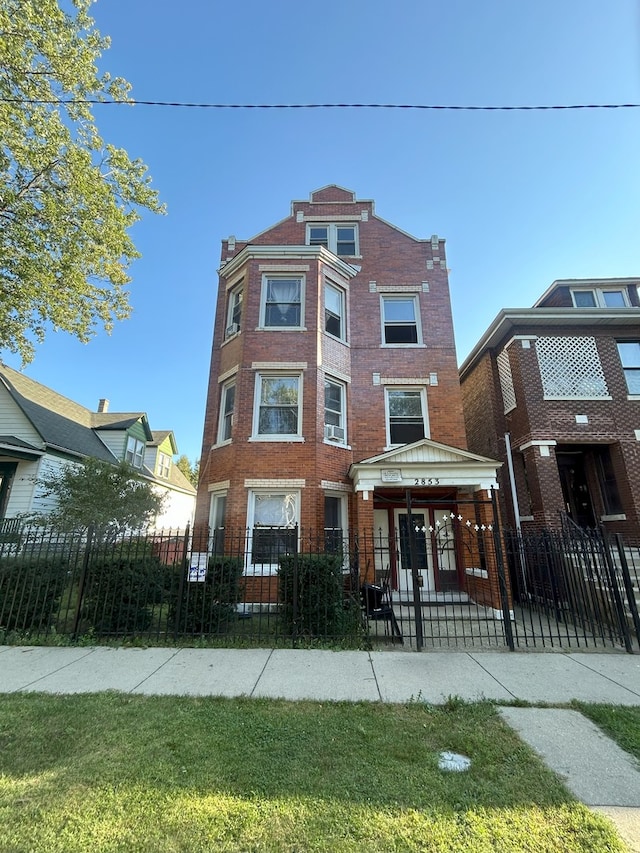 2853 W 40th St, Chicago, IL 60632 - view of front facade featuring brick siding and a fenced front yard