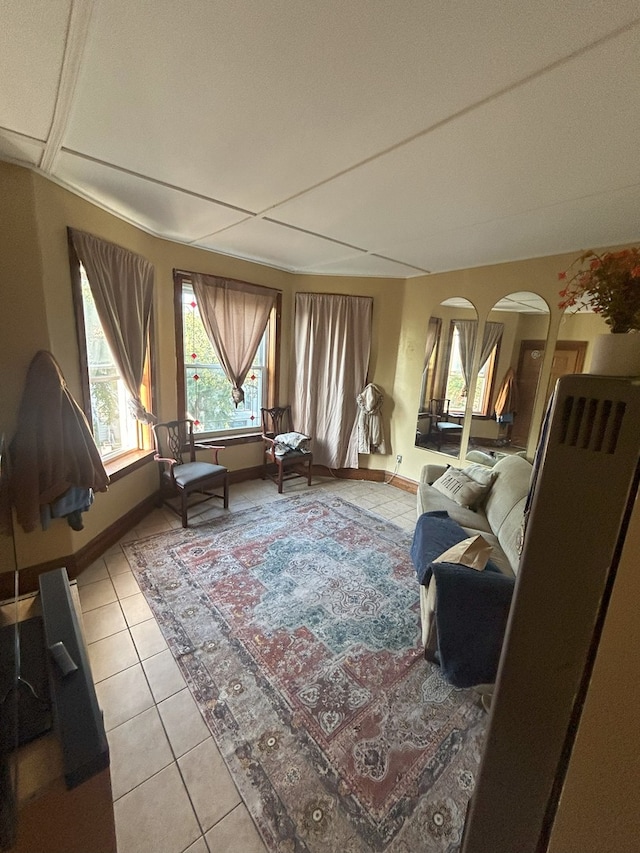 2853 W 40th St, Chicago, IL 60632 - living room featuring light tile patterned floors, baseboards, and arched walkways