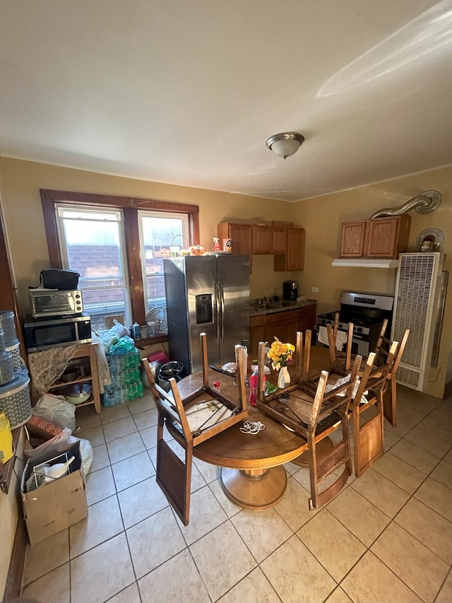 2853 W 40th St, Chicago, IL 60632 - dining area featuring light tile patterned floors and a heating unit
